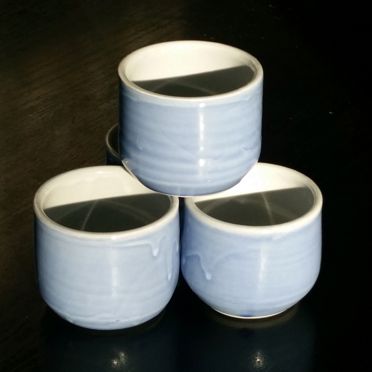 Coffee cup (no handle) in blue & green by Clifton Hill Pottery in